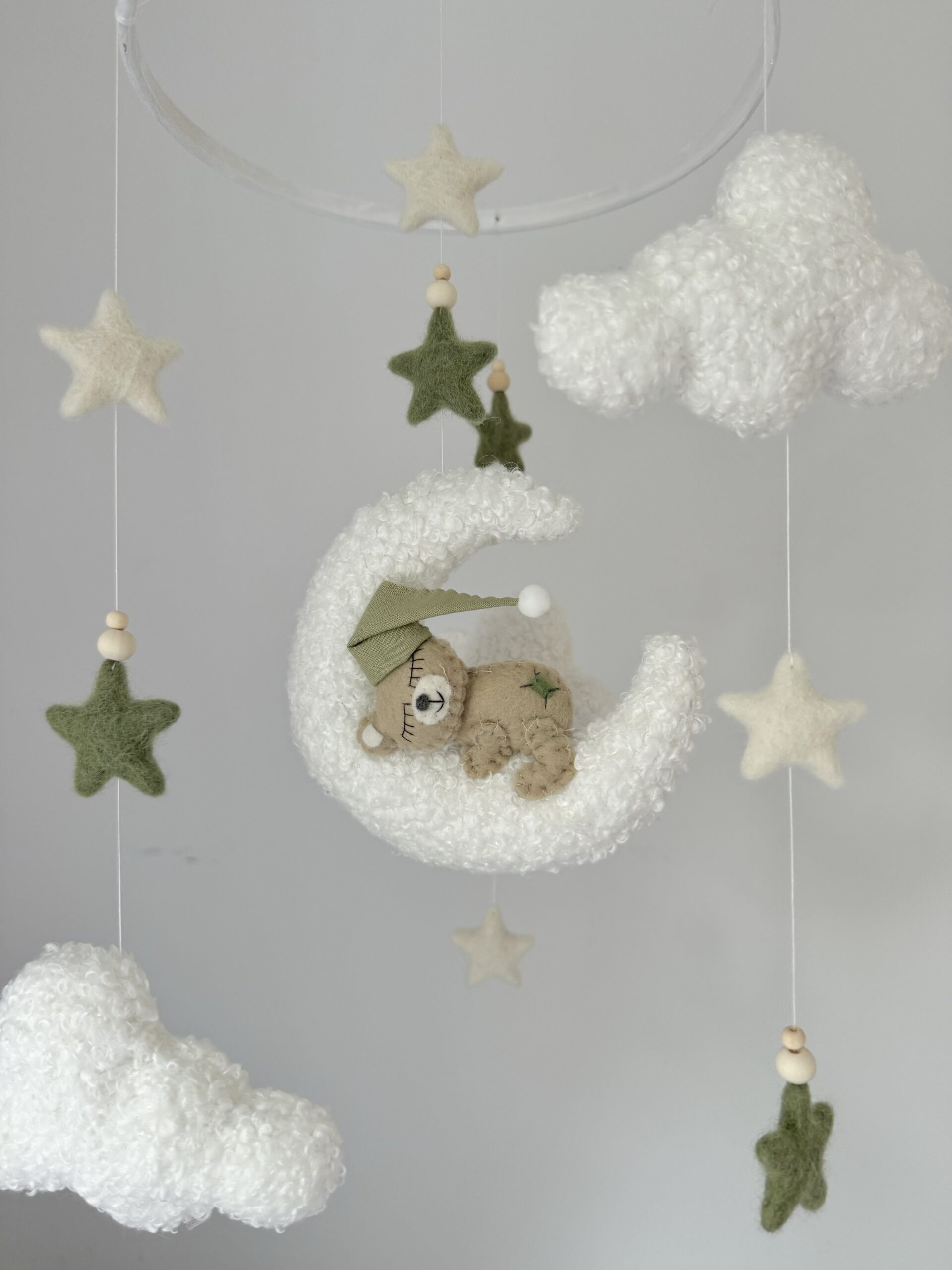 Sage green details on the sleeping Teddybear mobile.